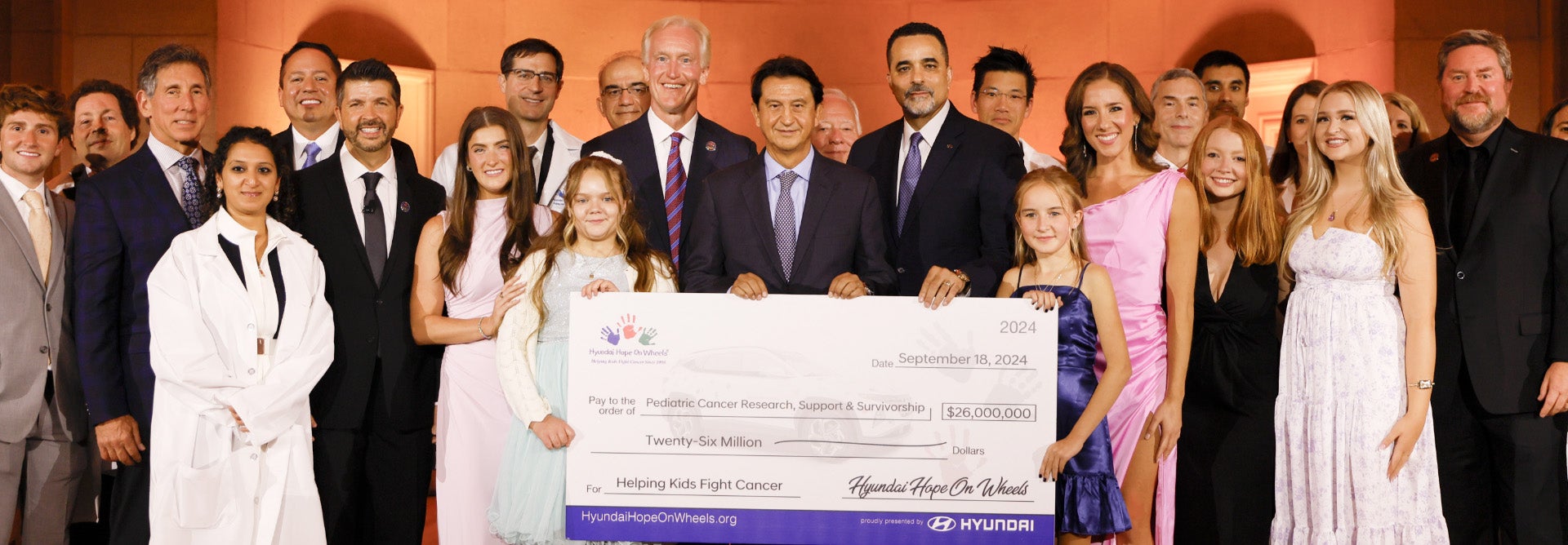 helping kids fight cancer foundation showing their big check from hyundai hope on wheels - Oakland Hyundai in Oakland CA